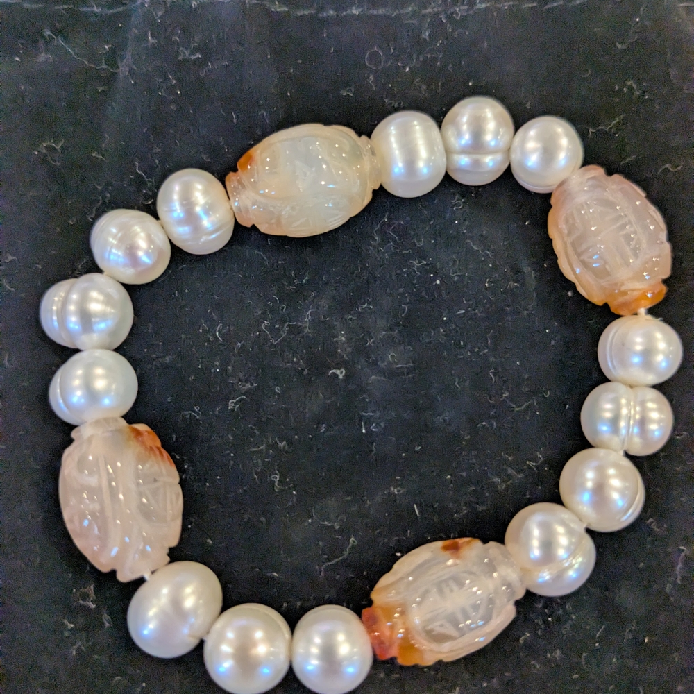 Elegant Pearl and Carved Stone Bracelet
